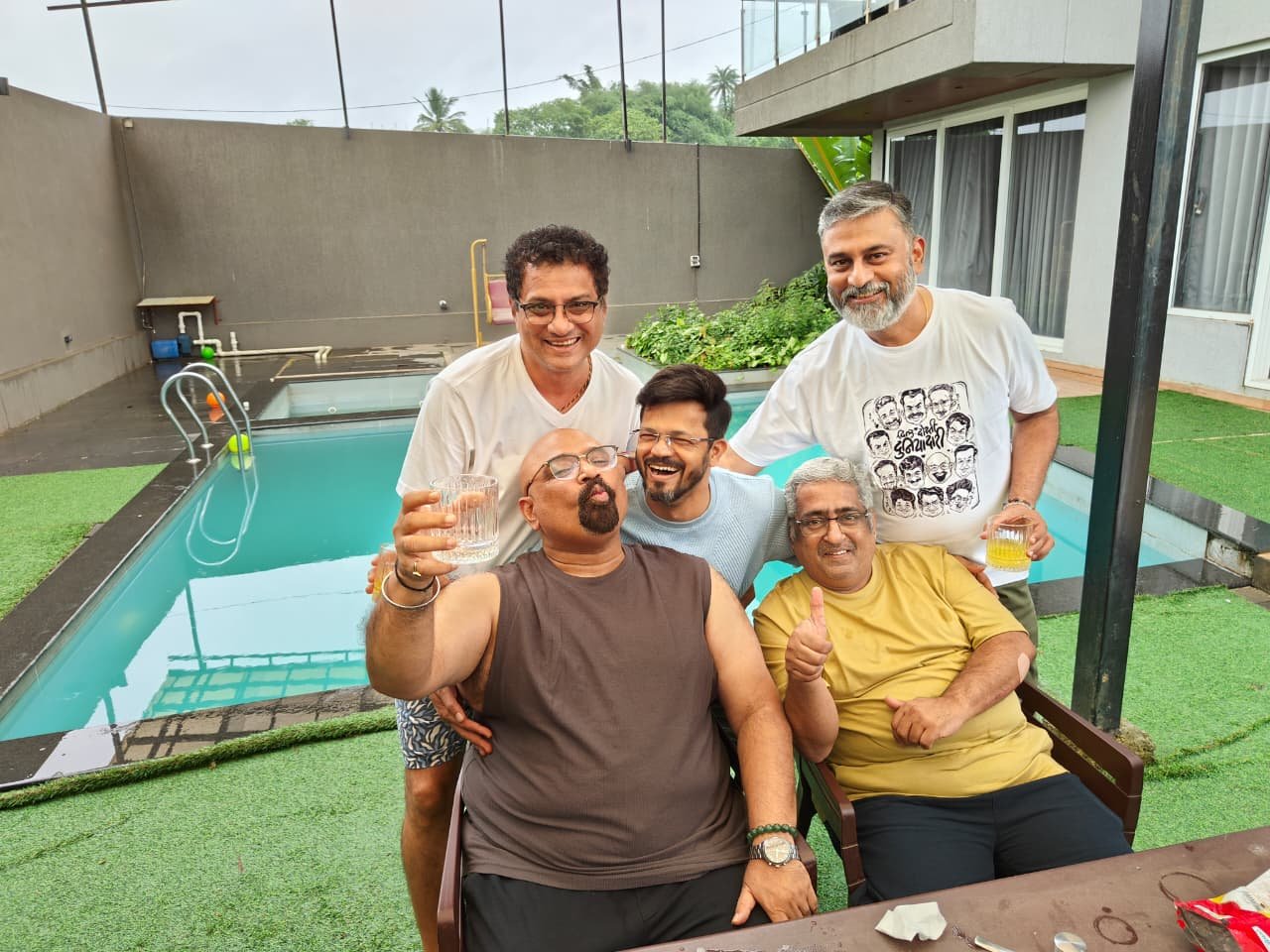 Posing together at the edge of the pool